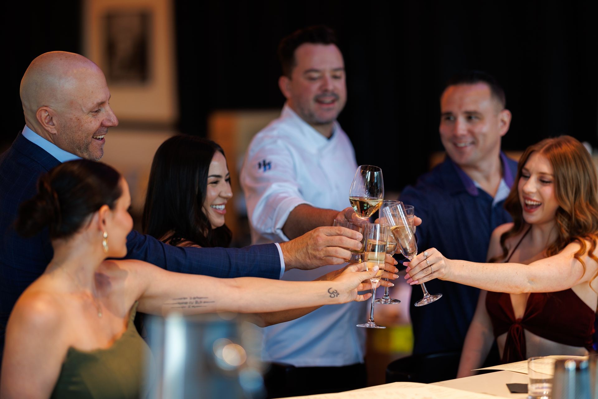  people in cafe with smile toasting